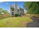 View of a well-maintained backyard featuring a lush lawn, and a wood fence at 4104 Glenaire Nw Way, Acworth, GA 30101