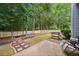 Beautiful backyard with a concrete patio, grill, and seating area at 4104 Glenaire Nw Way, Acworth, GA 30101