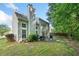 Backyard view with a patio, grill and lush green trees, ideal for enjoying the outdoors in privacy at 4104 Glenaire Nw Way, Acworth, GA 30101