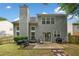 Spacious backyard with a patio, multiple grills, green grass, and a wooded fence at 4104 Glenaire Nw Way, Acworth, GA 30101