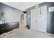 Bedroom featuring dark gray walls, large double-door closet, and comfortable carpeting at 4104 Glenaire Nw Way, Acworth, GA 30101