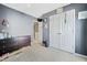 Bedroom showcasing a dark dresser, double closet, and view into hall at 4104 Glenaire Nw Way, Acworth, GA 30101