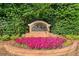 Paces Club community sign displayed amongst lush greenery and vibrant flowers at 4104 Glenaire Nw Way, Acworth, GA 30101