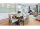 Open dining area with wood table and chairs in a naturally lit space at 4104 Glenaire Nw Way, Acworth, GA 30101