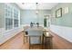Bright dining room with large window, table, chairs, and bench creating an inviting space for meals and gatherings at 4104 Glenaire Nw Way, Acworth, GA 30101