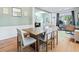 Inviting dining room with wood table and chairs offers a comfortable space for meals, with a view into the home office at 4104 Glenaire Nw Way, Acworth, GA 30101