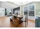 Open-concept dining room and home office combination creates a harmonious space for work and leisure, with wood flooring at 4104 Glenaire Nw Way, Acworth, GA 30101