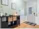 Bright entryway with wood floors and a decorative storage unit at 4104 Glenaire Nw Way, Acworth, GA 30101