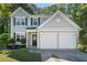 Charming two-story home featuring a two car garage, well-maintained lawn, and inviting front entrance at 4104 Glenaire Nw Way, Acworth, GA 30101