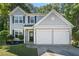 Charming two-story home with a two-car garage, well-maintained lawn, and classic architectural details at 4104 Glenaire Nw Way, Acworth, GA 30101