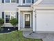 Inviting front entrance with a black door, sidelights, and manicured bushes at 4104 Glenaire Nw Way, Acworth, GA 30101