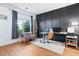 Bright home office features a modern accent wall, large window, desk, and comfortable seating area at 4104 Glenaire Nw Way, Acworth, GA 30101