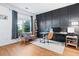 Bright home office features a stylish accent wall and functional workspace with plenty of natural light and comfortable seating at 4104 Glenaire Nw Way, Acworth, GA 30101