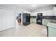 Updated kitchen featuring stainless steel appliances, tiled floor, and black backsplash at 4104 Glenaire Nw Way, Acworth, GA 30101