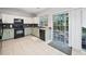 Updated kitchen includes stainless steel appliances, and sliding glass doors lead to the outdoor space at 4104 Glenaire Nw Way, Acworth, GA 30101