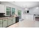 Updated kitchen with granite countertops, tile backsplash, and stainless steel appliances at 4104 Glenaire Nw Way, Acworth, GA 30101