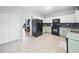 Well-lit kitchen features ample storage space, a black refrigerator, and views to the dining area at 4104 Glenaire Nw Way, Acworth, GA 30101