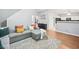 Comfortable living room featuring a gray sectional sofa, hardwood floors, and an open layout at 4104 Glenaire Nw Way, Acworth, GA 30101