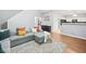Cozy living room featuring wood-look floors, a plush sofa, and an open layout at 4104 Glenaire Nw Way, Acworth, GA 30101