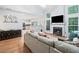 Bright living room features hardwood floors, a fireplace, and a view into the kitchen at 4104 Glenaire Nw Way, Acworth, GA 30101