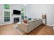 Bright living room with fireplace, large windows, and hardwood floors at 4104 Glenaire Nw Way, Acworth, GA 30101