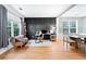 Office/den has large windows, hardwood floors, and modern design elements at 4104 Glenaire Nw Way, Acworth, GA 30101