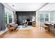 Home office with a decorative accent wall, hardwood floors, and lots of natural light at 4104 Glenaire Nw Way, Acworth, GA 30101