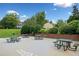 Community picnic area featuring multiple tables and grills against a backdrop of green lawns at 4104 Glenaire Nw Way, Acworth, GA 30101