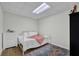 Cozy bedroom with white furniture, soft rug, and ample natural light at 7155 Bannister Park Ln, Cumming, GA 30028