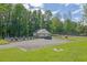 Community Pool featuring lounge seating, parking area and picnic tables at 7155 Bannister Park Ln, Cumming, GA 30028