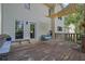 Large wooden deck with shade covering, offering ample space for outdoor entertaining at 7155 Bannister Park Ln, Cumming, GA 30028