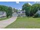 Charming two-story home with an attached garage, well-maintained lawn, and inviting curb appeal at 7155 Bannister Park Ln, Cumming, GA 30028