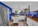 Bright kitchen with blue backsplash, butcher block countertops, and stainless steel appliances at 7155 Bannister Park Ln, Cumming, GA 30028