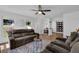 Inviting living room featuring wood floors and a cozy seating arrangement at 7155 Bannister Park Ln, Cumming, GA 30028