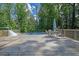 Outdoor pool deck with seating, great for entertaining and summer relaxation at 7155 Bannister Park Ln, Cumming, GA 30028