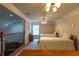 Spacious bedroom with two beds, a window, and an overhead ceiling fan at 10110 Malcolm Ct, Covington, GA 30014