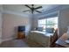 Cozy bedroom with natural light, soft carpet, and a classic daybed at 10110 Malcolm Ct, Covington, GA 30014