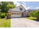 Charming single-Gathering home with a brick facade and a two-car garage at 10110 Malcolm Ct, Covington, GA 30014