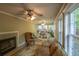 Inviting living room with fireplace, lots of light and comfortable seating area at 10110 Malcolm Ct, Covington, GA 30014