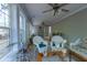 Bright sunroom with lots of windows and comfortable wicker furniture at 10110 Malcolm Ct, Covington, GA 30014