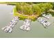 Overhead shot of a marina with multiple docks, boats, and serene lakefront scenery at 10213 Tall Pine Ct, Villa Rica, GA 30180