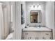The updated bathroom features modern fixtures and granite counters at 10213 Tall Pine Ct, Villa Rica, GA 30180