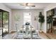 Bright dining area with a view to the exterior, featuring a round table and neutral decor at 10213 Tall Pine Ct, Villa Rica, GA 30180