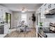 Inviting dining area adjacent to the kitchen, featuring a round table and stylish decor at 10213 Tall Pine Ct, Villa Rica, GA 30180