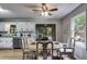 Bright dining area with a view to the exterior, featuring a round table and neutral decor at 10213 Tall Pine Ct, Villa Rica, GA 30180