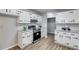 Well-appointed kitchen featuring white cabinets, granite countertops, and stainless steel appliances at 10213 Tall Pine Ct, Villa Rica, GA 30180