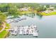 Scenic lake view showcasing a marina with numerous boat slips filled with various boats on calm water at 10213 Tall Pine Ct, Villa Rica, GA 30180