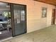 Screened porch with wood flooring and an opening to the dining area provides indoor/outdoor living at 10213 Tall Pine Ct, Villa Rica, GA 30180