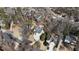 An aerial shot of a home surrounded by lush trees in a quiet neighborhood at 3290 Coachmans Ne Way, Roswell, GA 30075