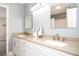 Bathroom features a double sink vanity with granite countertops, large mirrors, and modern fixtures at 3290 Coachmans Ne Way, Roswell, GA 30075